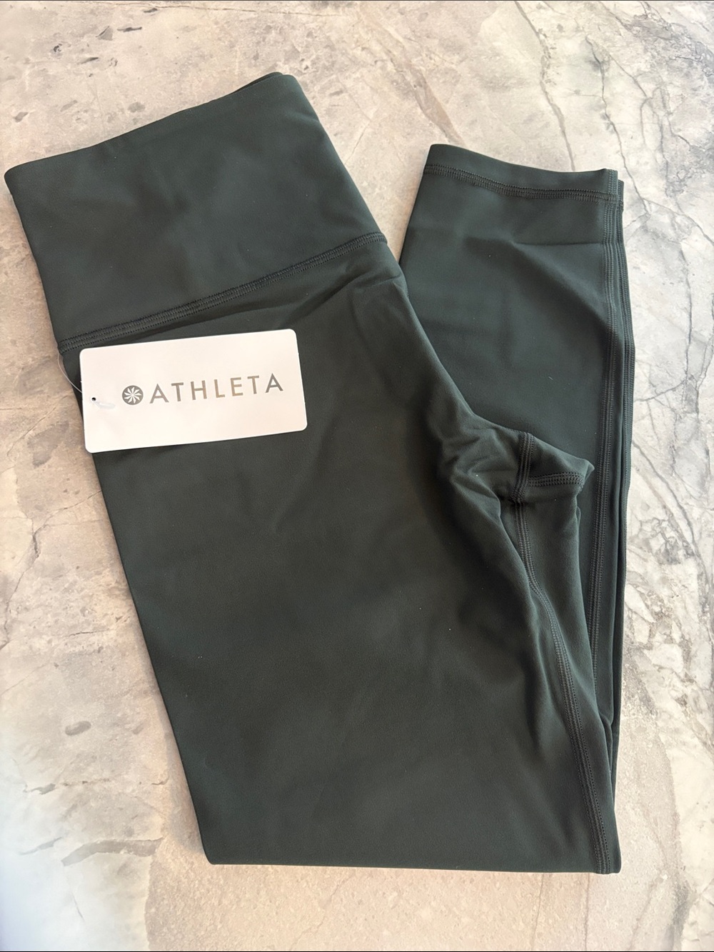 Athleta Elation Ultra High Rise  7/8 Leggings Color is Elm